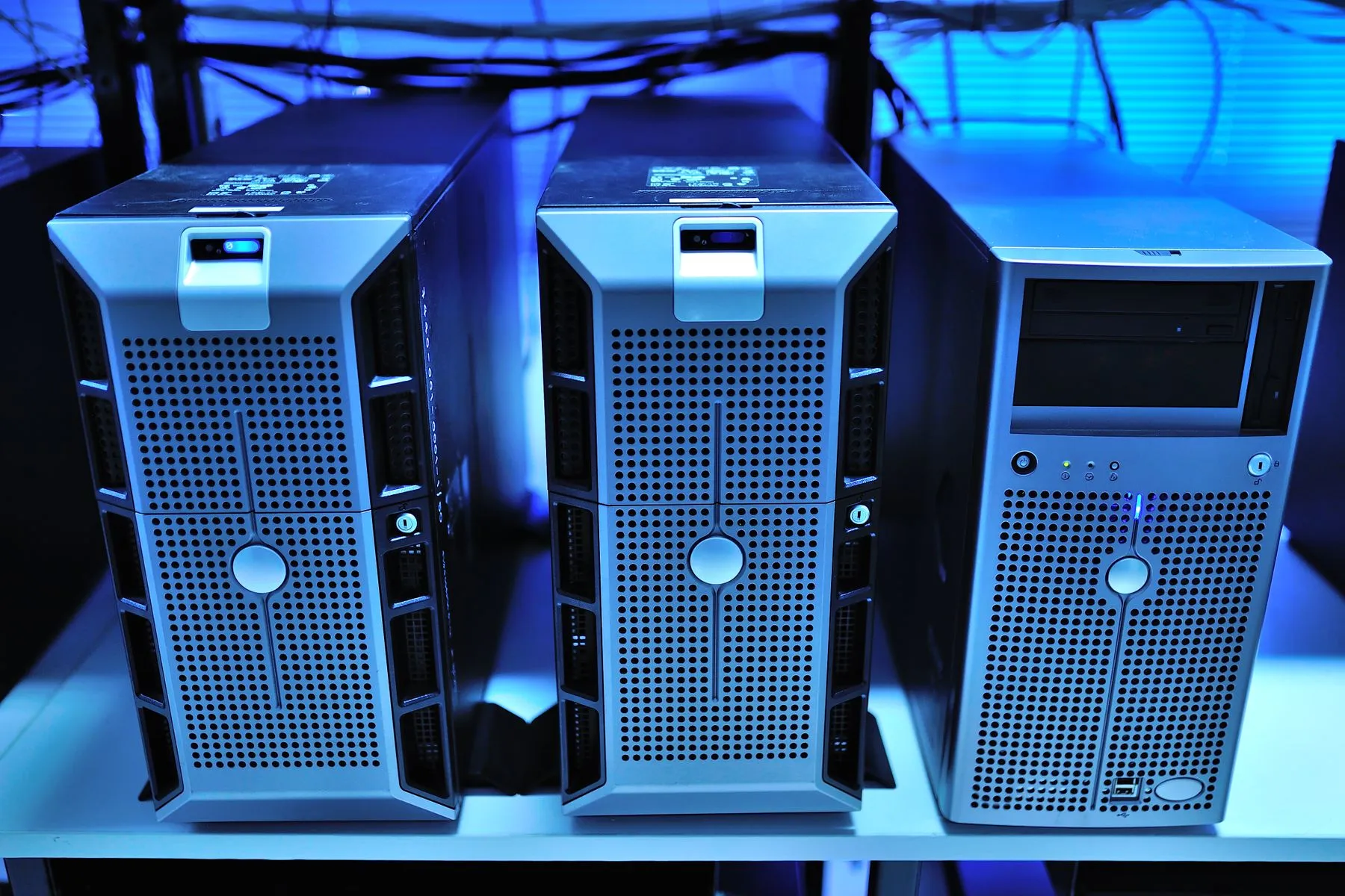 Blue-lit server towers in a data centre